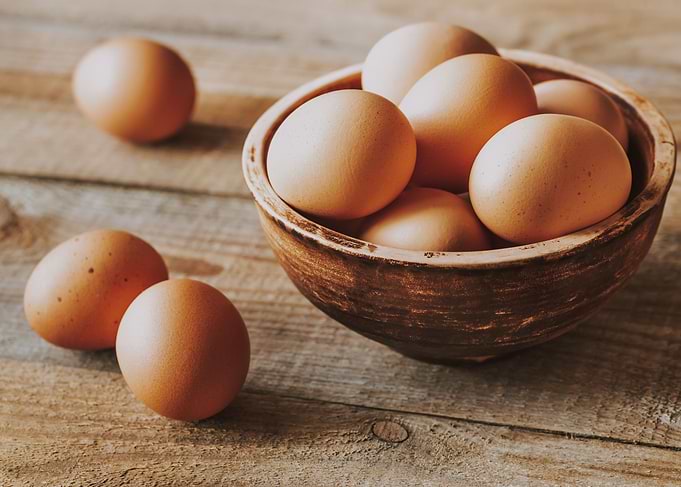 Bowl of raw chicken eggs