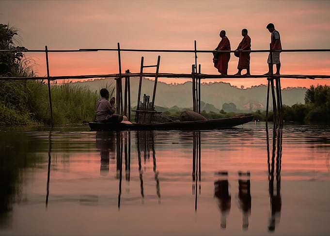 Three monks on a bridge