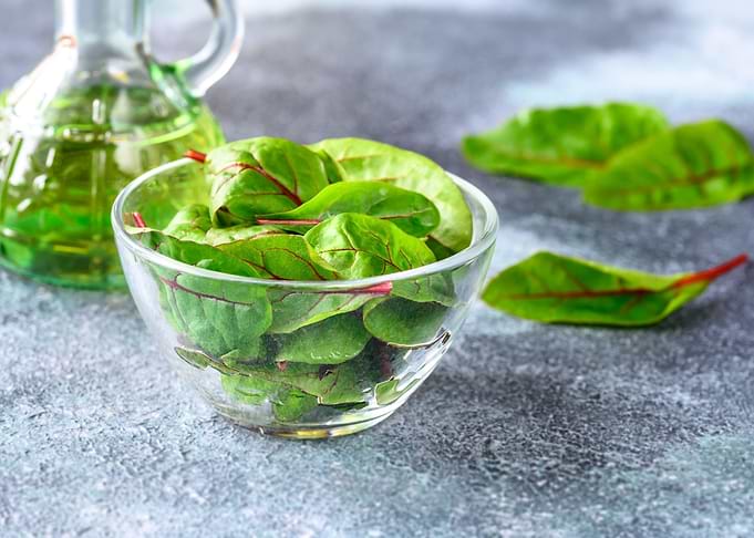 Glass bowl of red chard