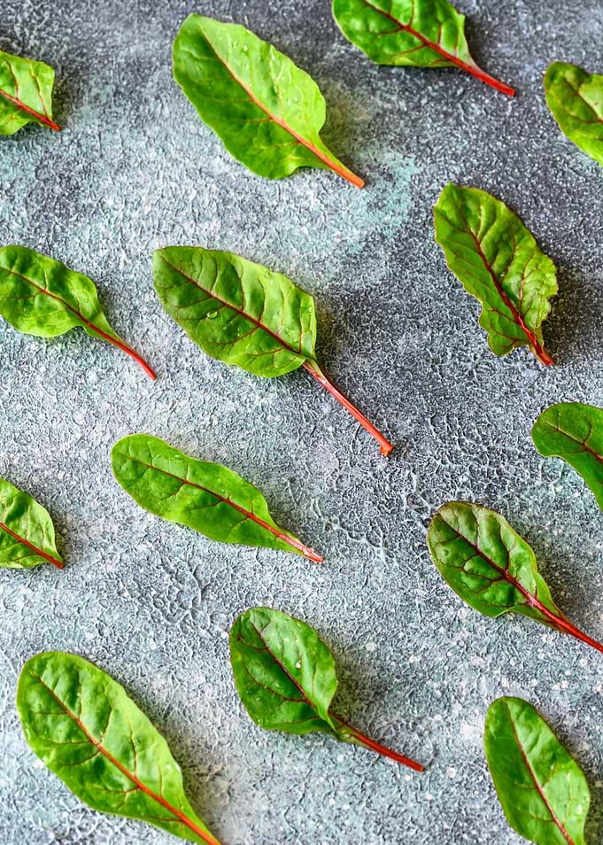 Red chard on gray board