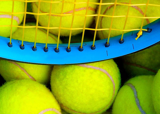 Tennis Balls And A Racket