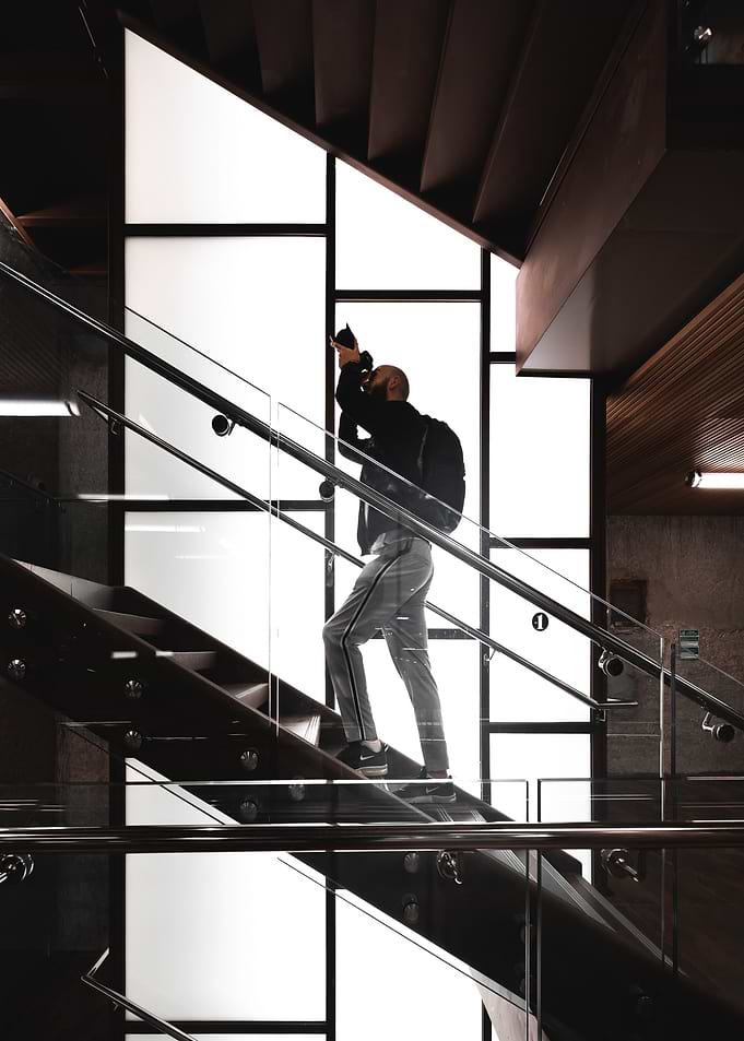 standing man on stairs