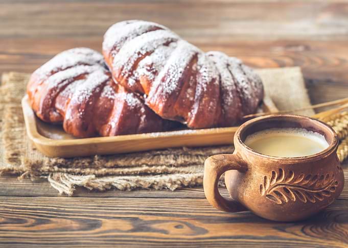 Buns with cup of coffee
