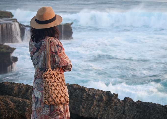 Woman looking at the ocean
