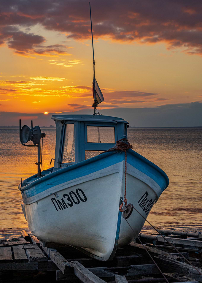 Fishing boat at sunset