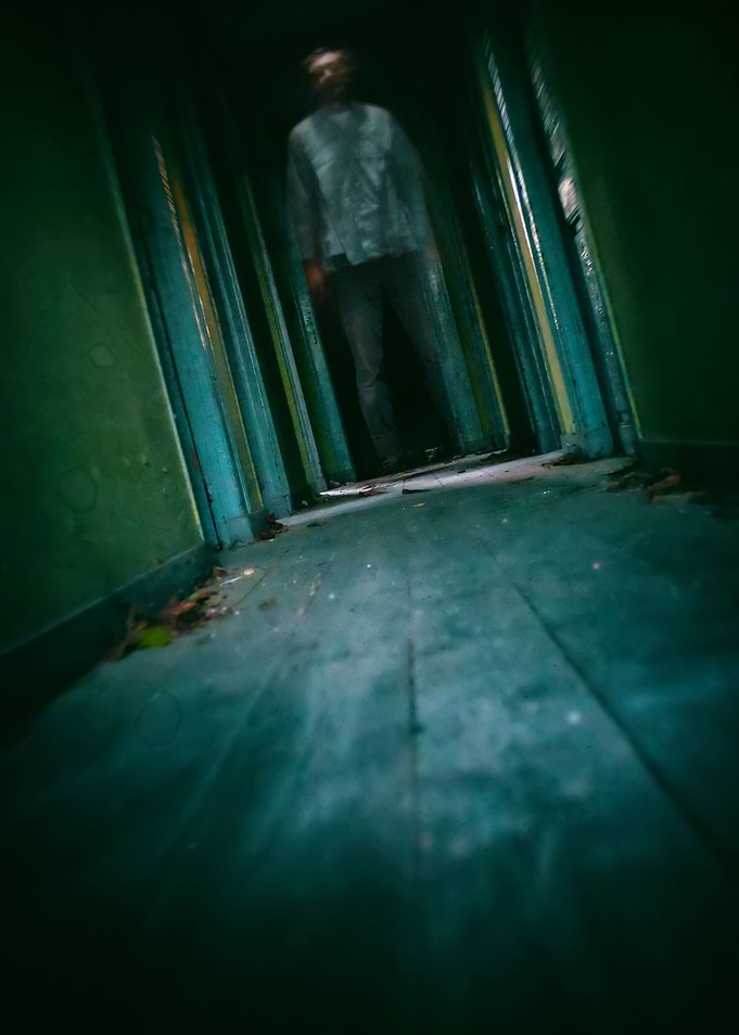 Blurred man in a hallway