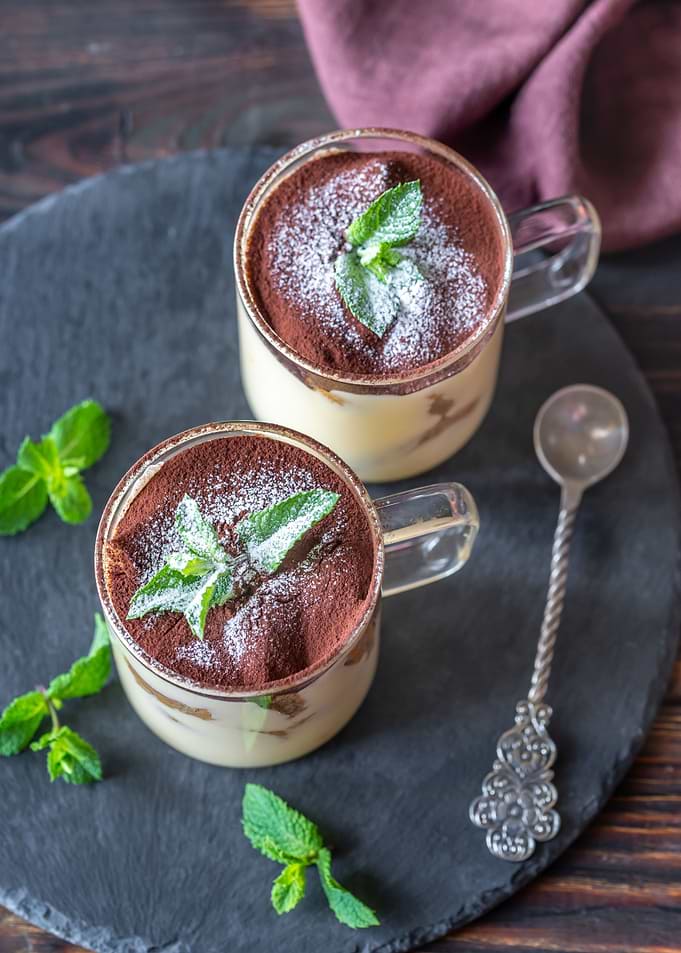 Two glass mugs of tiramisu