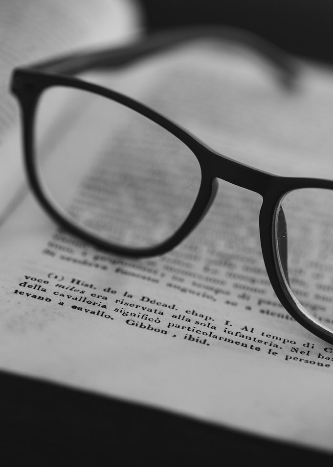 Eye glass on book