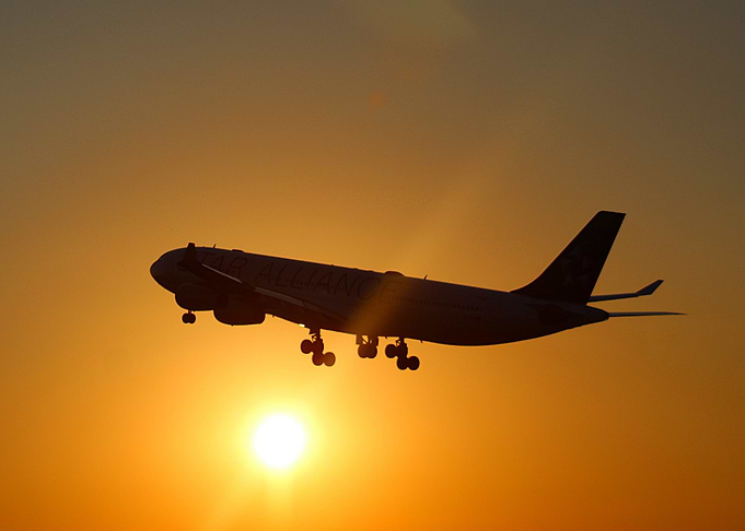 Airplane takeoff in sunset