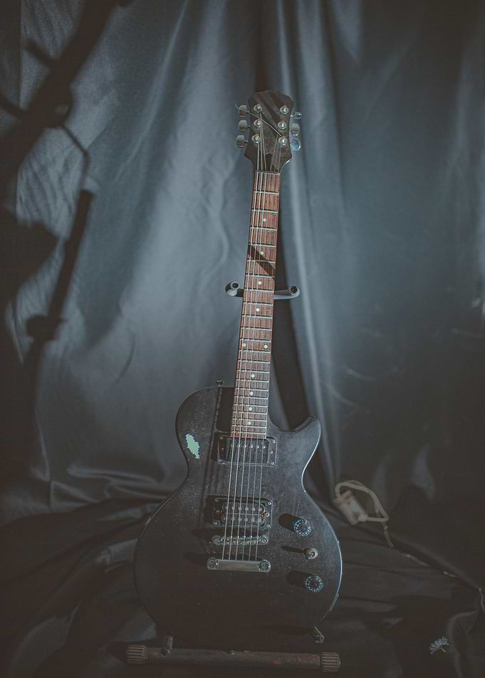 stand guitar night