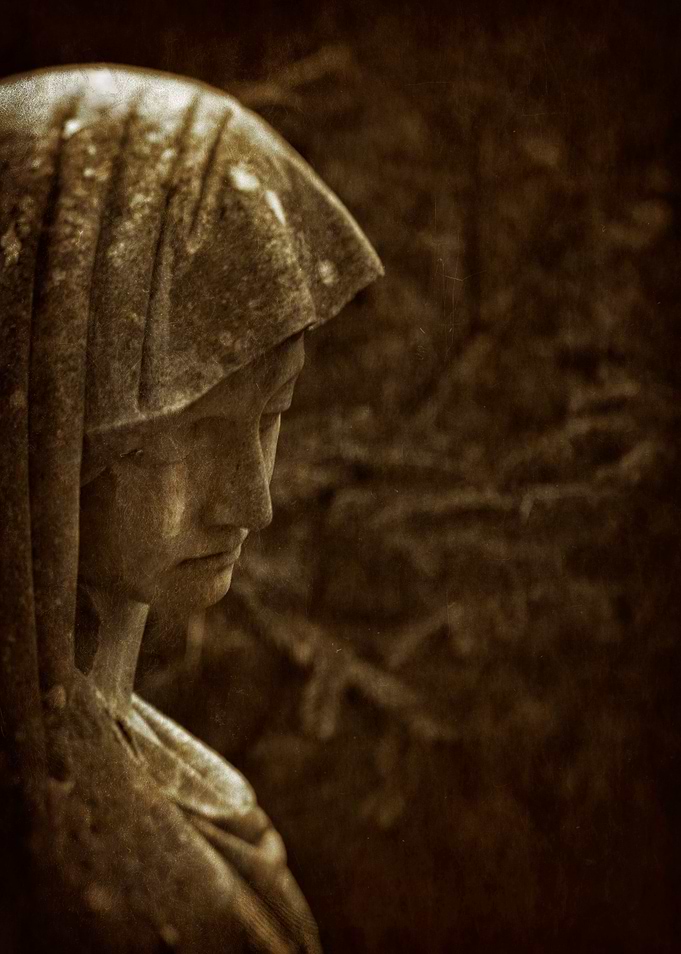 Grieving cemetery statue