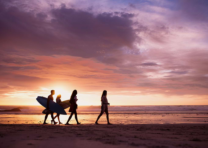 Surfers and Sunset Beach