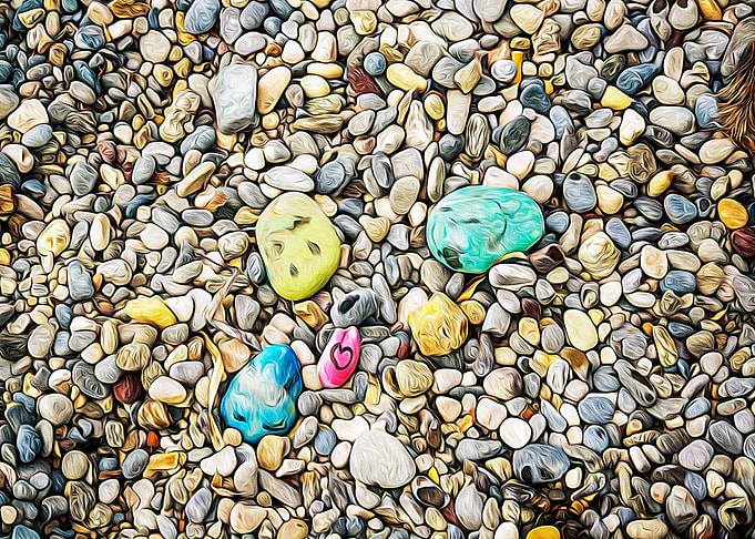 Stones painted on a beach