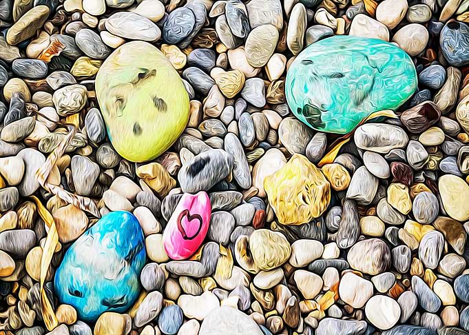 Stones painted on a beach