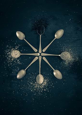 Spices on silver spoons