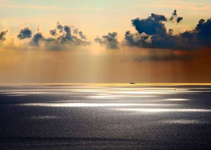 sun lights spot on sea