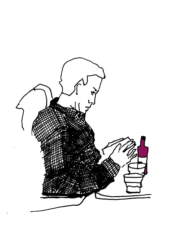 Guy reading at plane