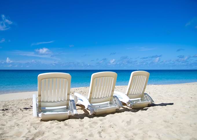 Chaise Lounges on a Sandy