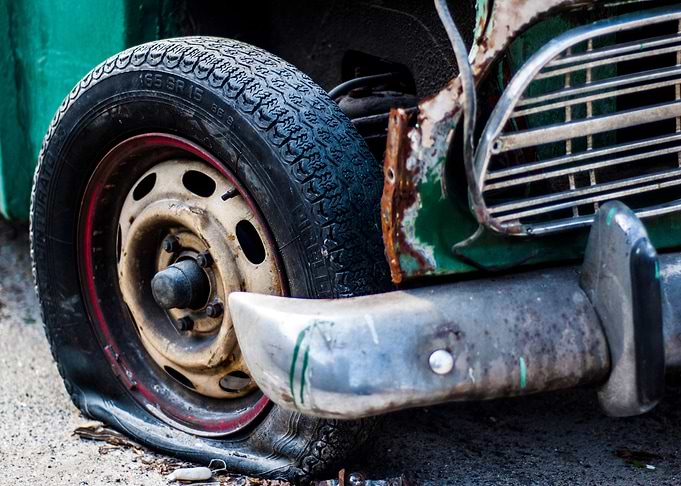 Flat tire on vintage car