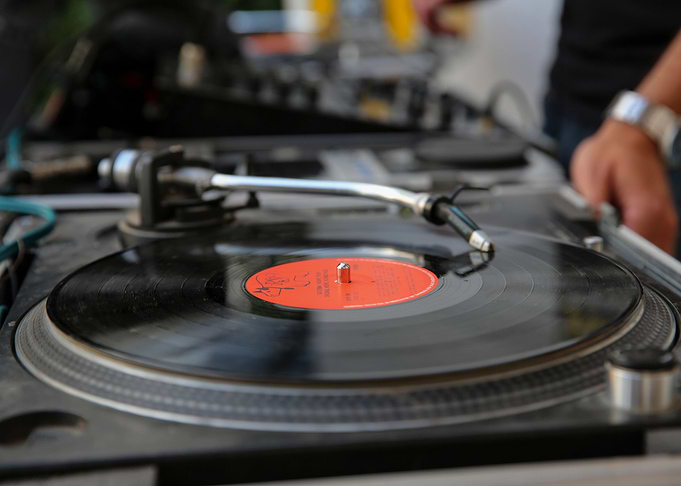 A disk jockey plays music