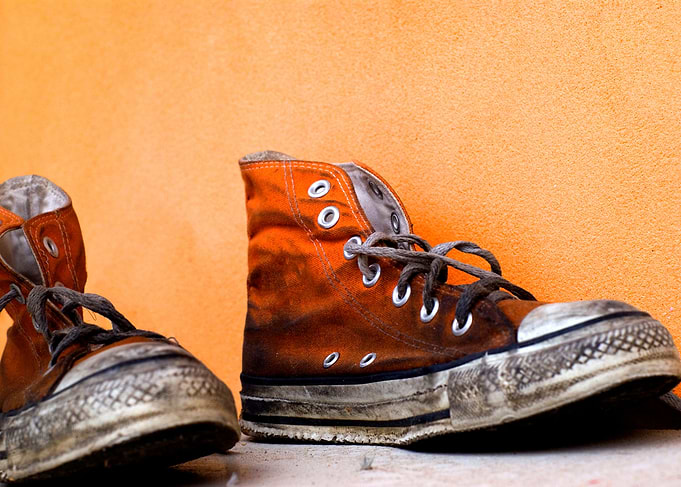 Old used soiled trainers