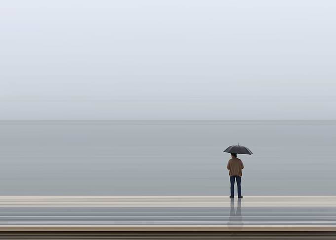 Man in rain with umbrella
