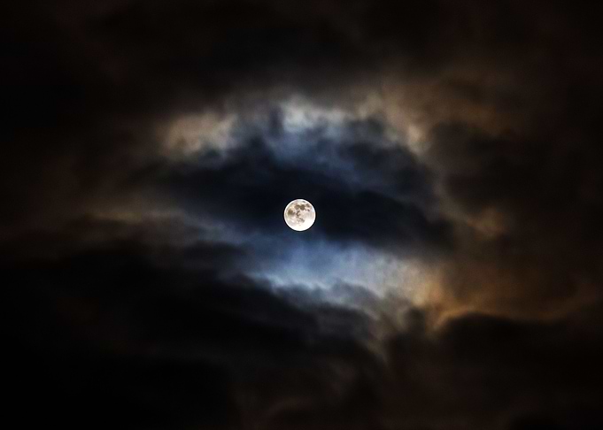 Moon surrounded by clouds