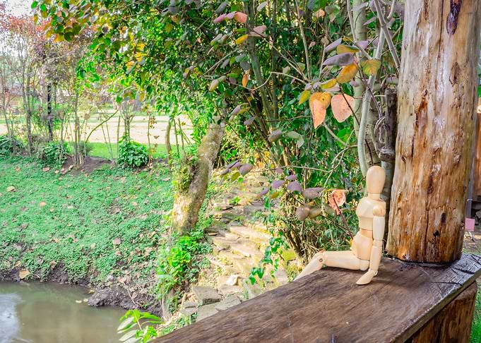 Wooden manikin sitting