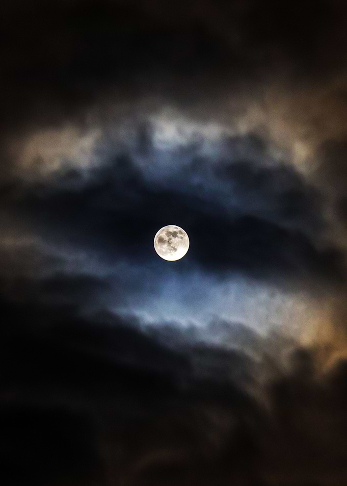 Moon surrounded by clouds