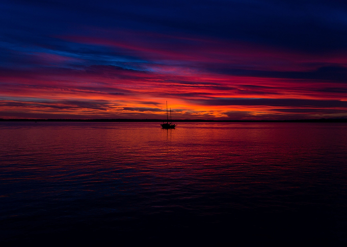 Sunset with boat on lake