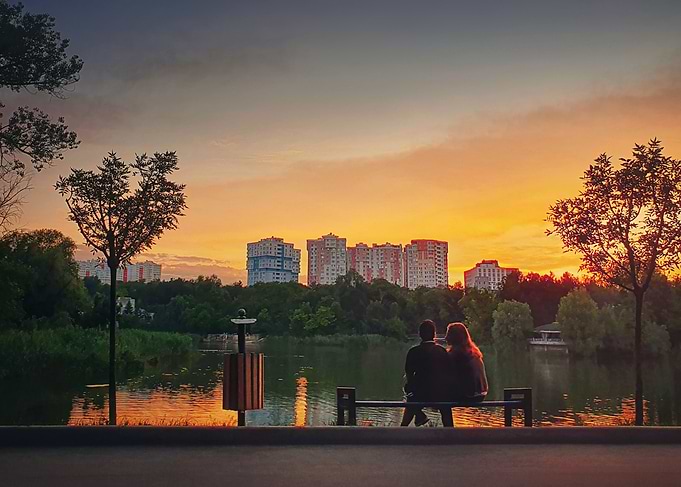 young couple meets sunset