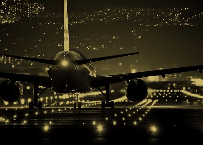 Plane landing on track