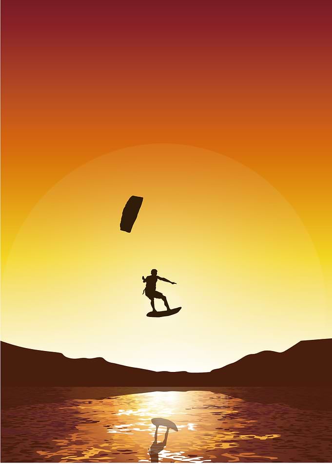 Surfer flying under sunset