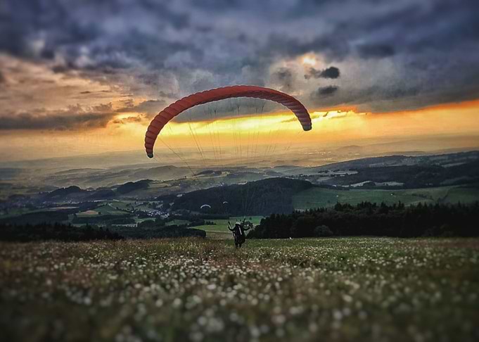 Paraglider take off Sunset