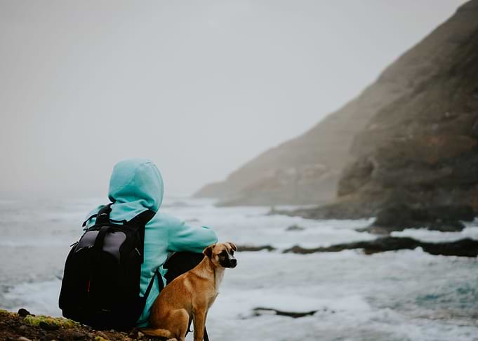 Man With A Dog In Front Of