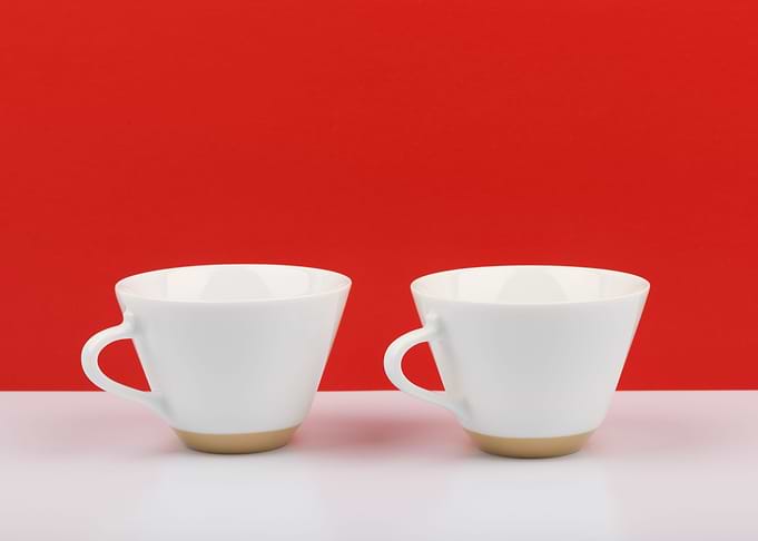 Cups on red background