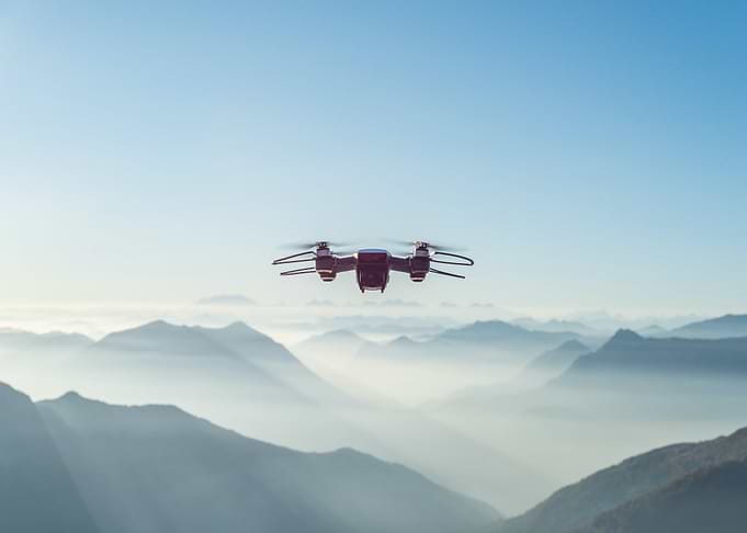 Drone flying over mountain