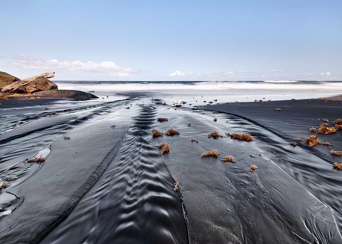 Dark beach with sand ribs