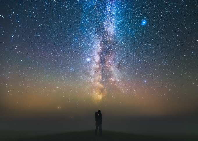 Couple against Milky way