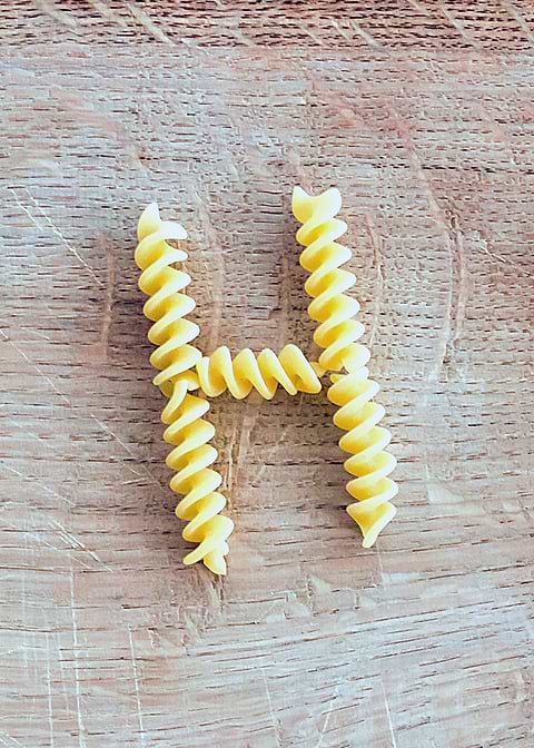 Letter composed with pasta