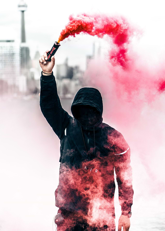 MAN IN HOODIE WITH SMOKE
