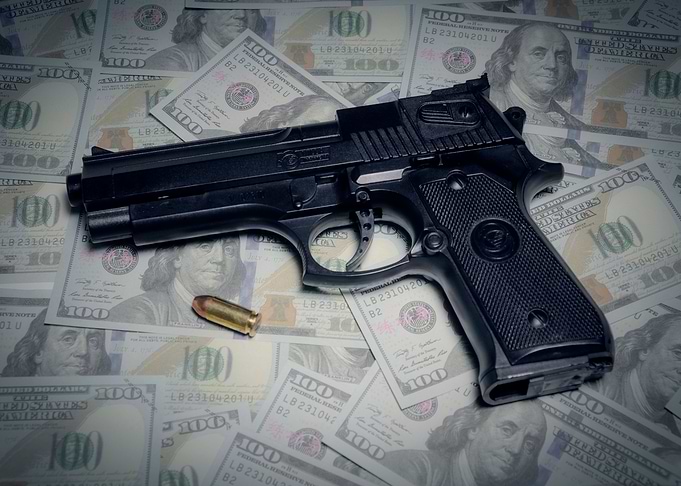 Gun bullet dollars composi