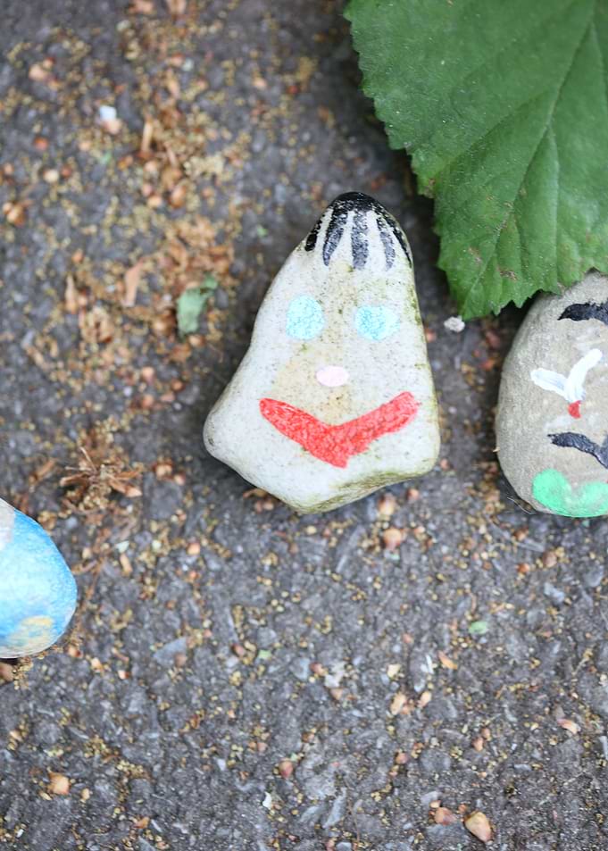 Kids drawing on stones