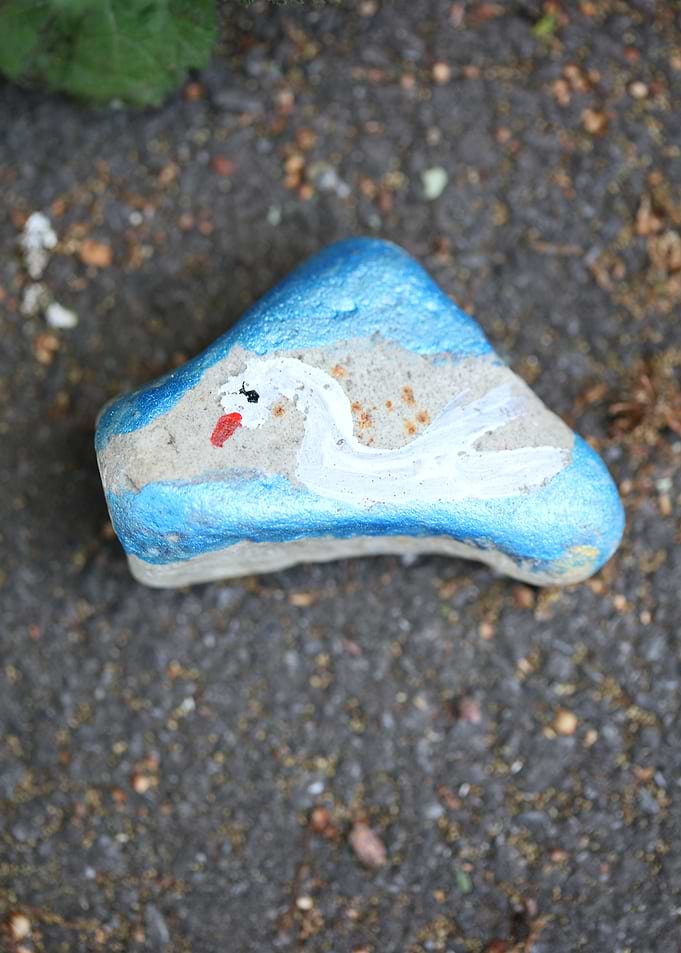 Kids drawing on stones