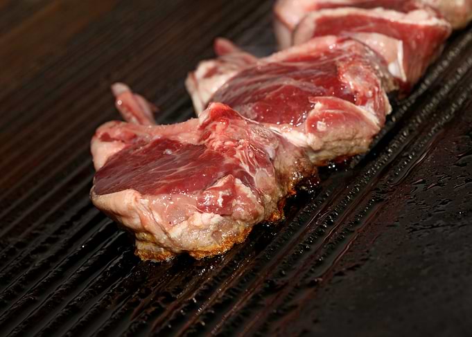 Meat baking on Greek grill