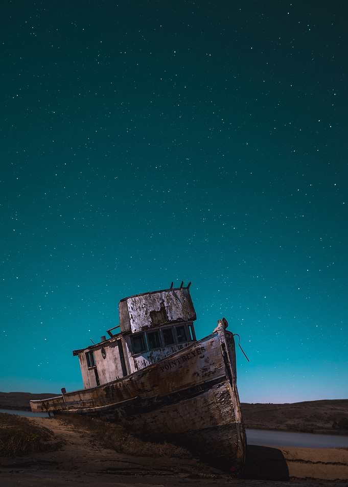 Ship wreck by starry night