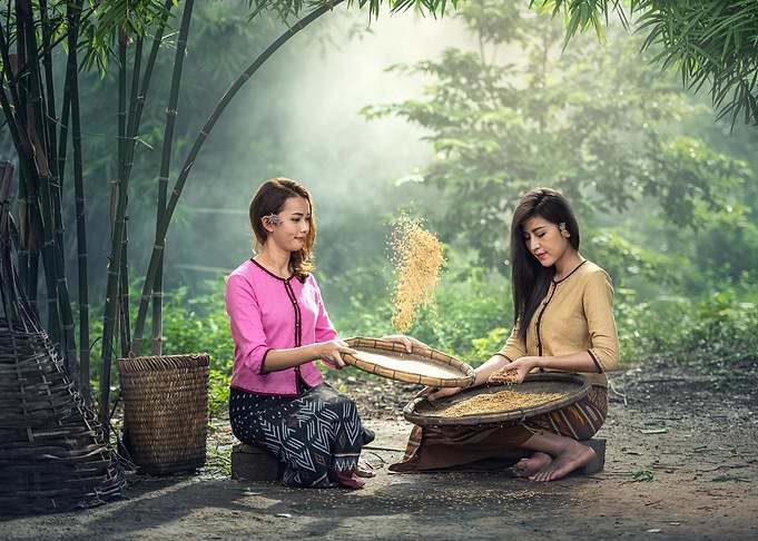 Yong women sifting