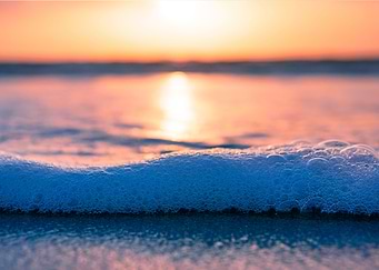 Seafoam on seashore