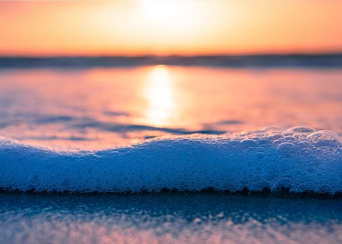 Seafoam on seashore