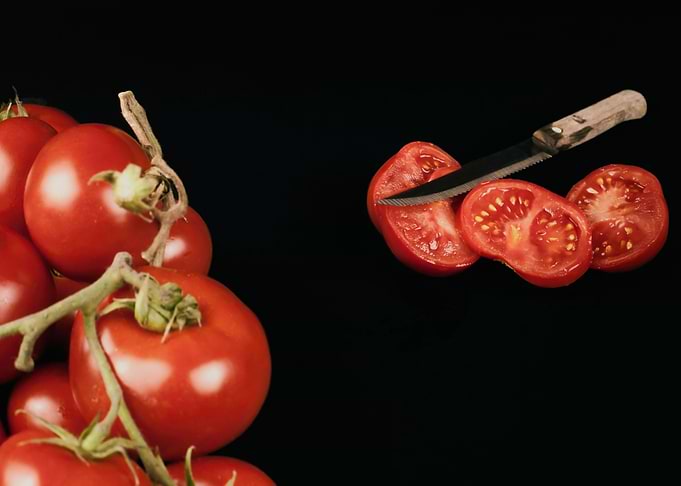 Tomatoes whole cut knife